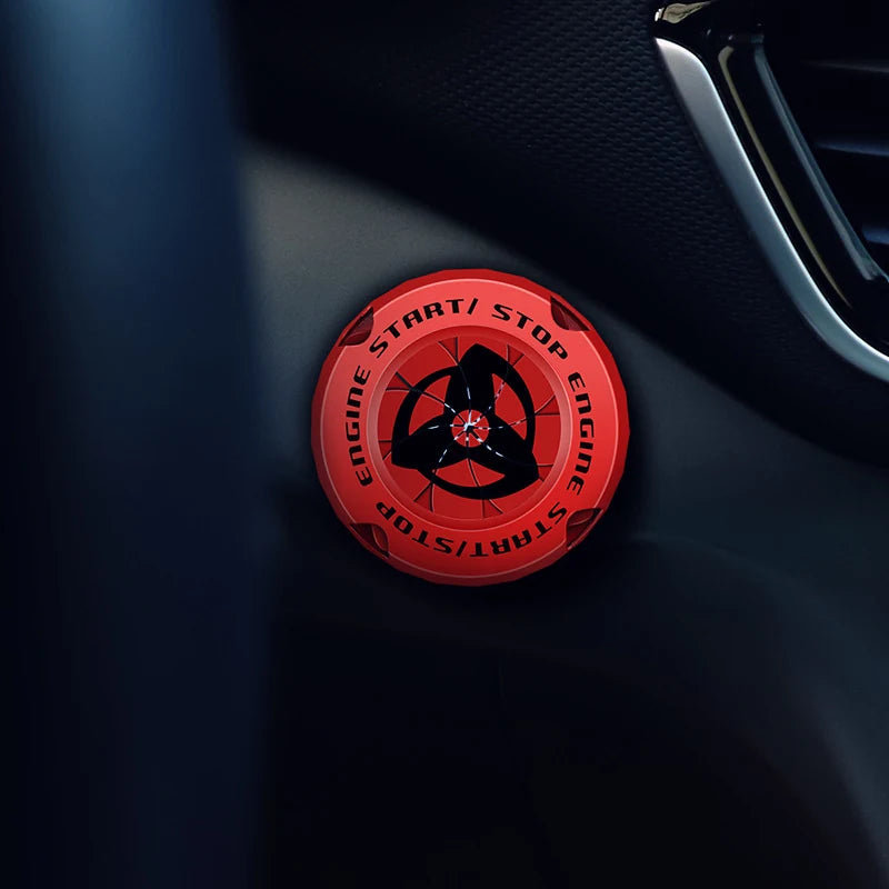 Red FYRASOL start button cover installed in a car interior